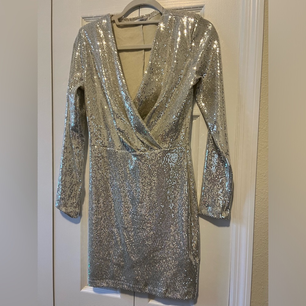 Champagne sequin long sleeved dress with plunging neckline